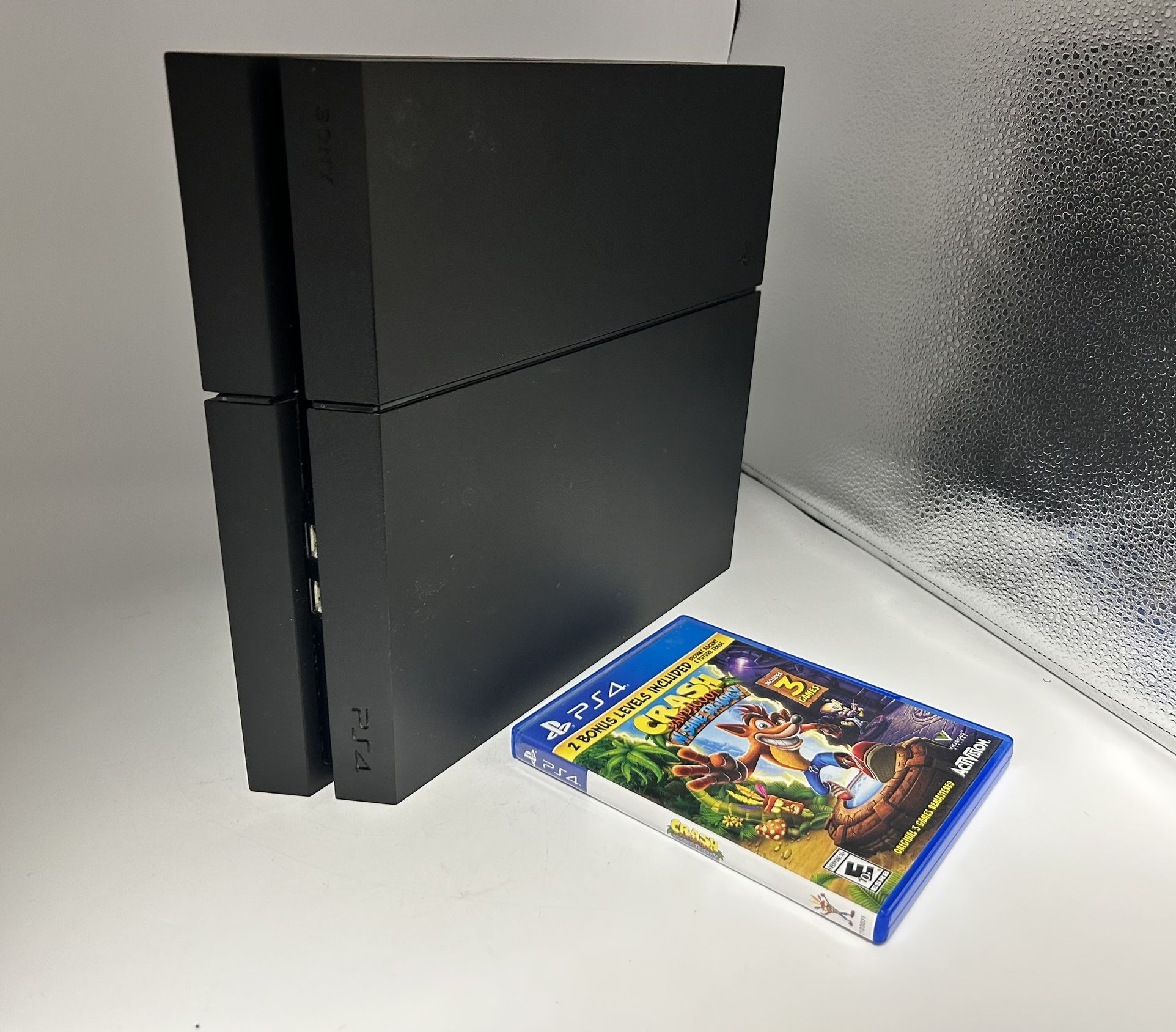 A PS4 Black Slim Console Including Game And Cords!