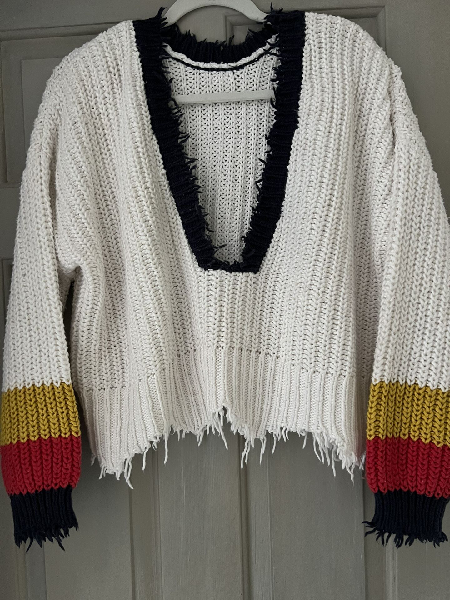 Wildfox- women's sneak out stripe Palmetto sweater and white with a deep V-neck and distressed edges