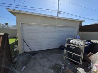 Pre owned sectional roll up two car garage door