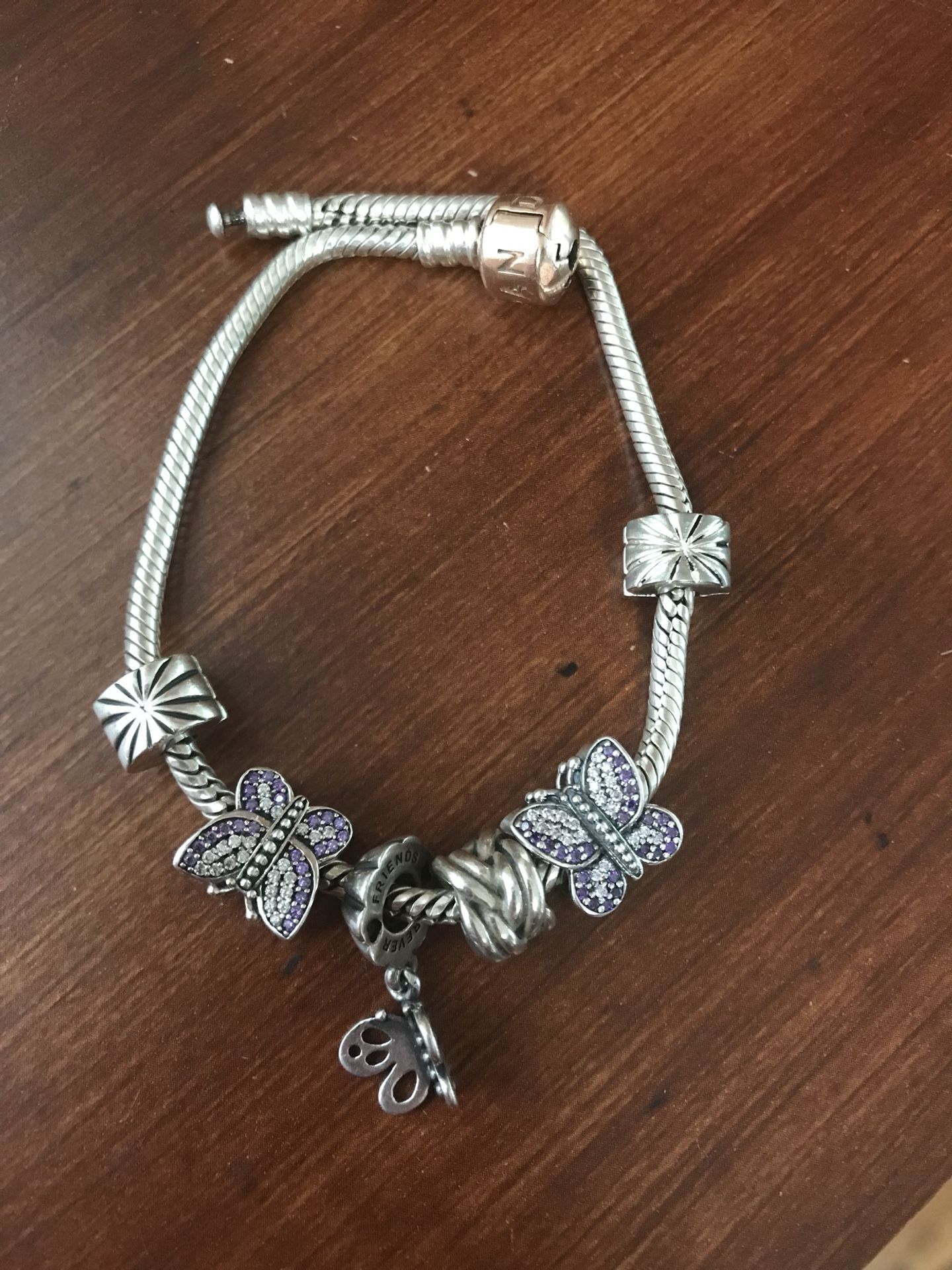 Authentic Pandora 8,5” bracelet with charms