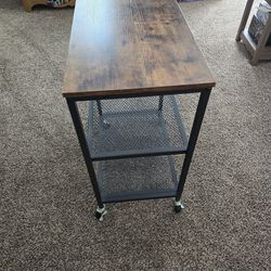 Rolling cart has locks on the bottom of wheels.