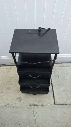 Black nightstand with charging station
