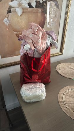 Newborn girl clothes and diapers