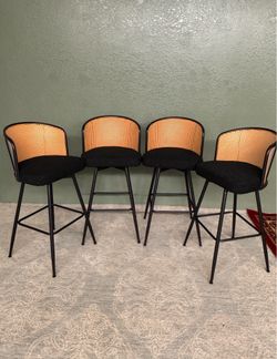 Set of 4 Swivel Bar Stools – Bouclé Fabric Upholstered Seats, Rattan Back, Metal Legs.
