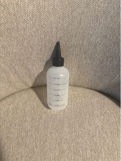 Solution measuring bottle with labels