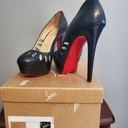 Authentic CHRISTIAN LOUBOUTIN  RED BOTTOMS 