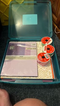Scrapbooking paper, ribbons and containers