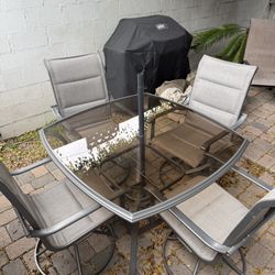 Nearly New Glass Patio Table And 4 Chairs 