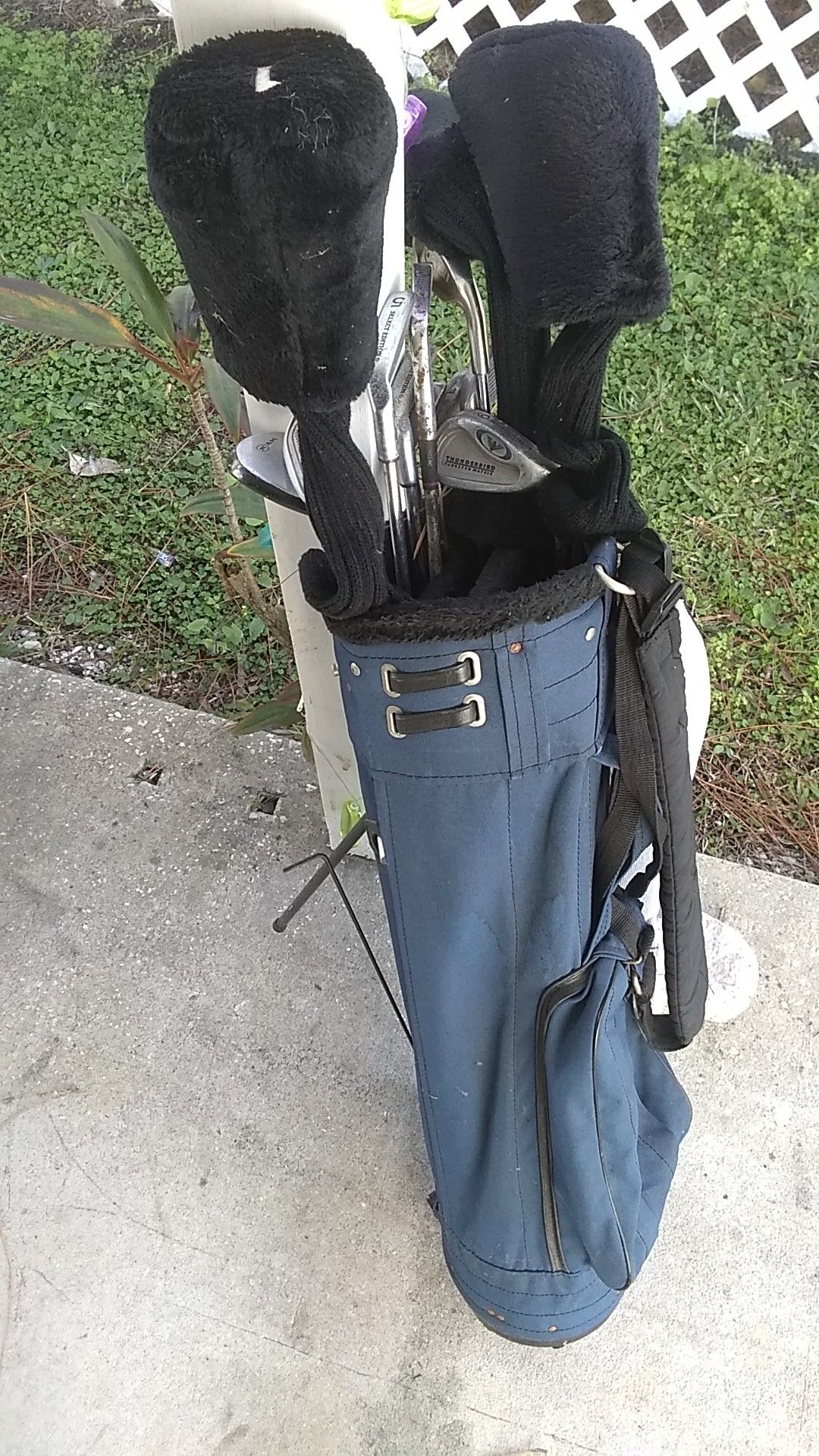 Assorted golf clubs