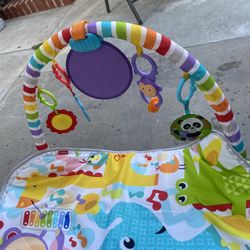 Green Fisher-Price Kick & Play Gym with Removable Piano for enhanced play