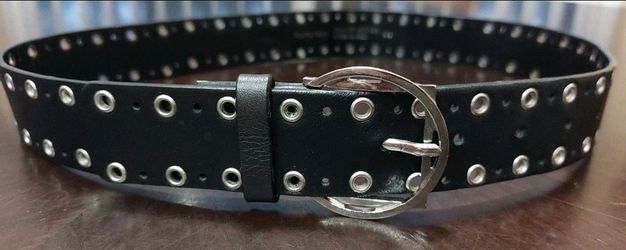 Black leather belt with silver eyelets by Punto Fibbia, an Italian manufacturer