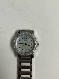 Women’s Citizen Eco-Drive dress watch with a mother-of-pearl dial and crystal-set bezel.