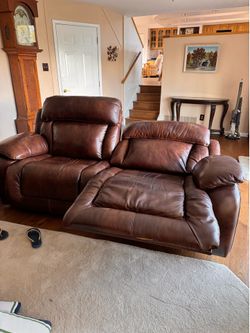 Two leather brown reclining sofa