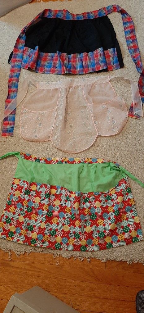 3 Vintage aprons. $10. each