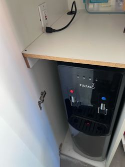 Primo water dispenser + 5 jugs