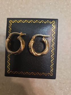 14 k gold earrings.  Weight is 1.8 grams