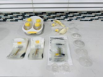 2 Medela pumps and milk storage system