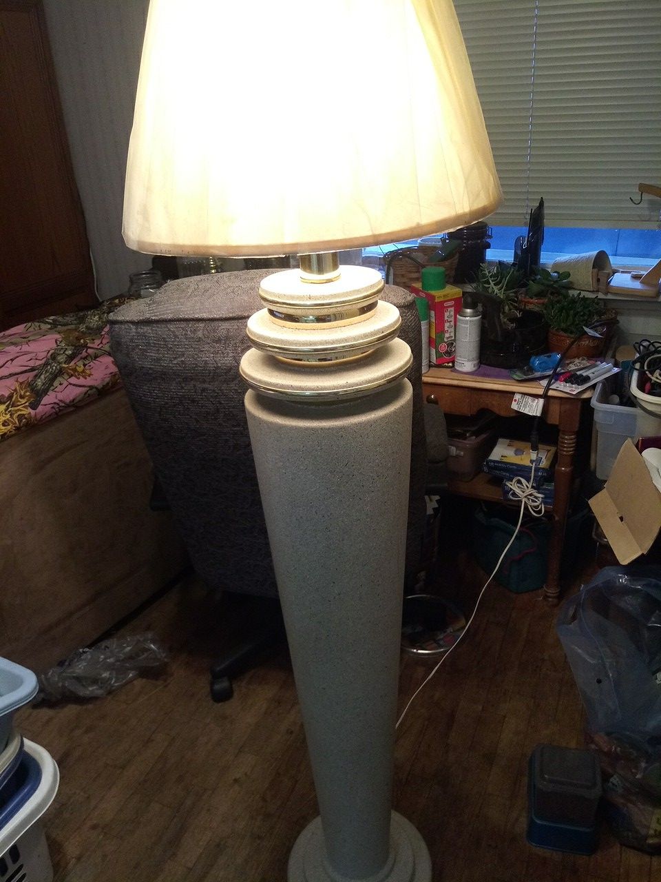 Thick heavy ceramic with brass Rings three way light switch 5 1/2 foot tall lamp with shade on.