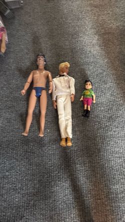 Three boy Barbie dolls