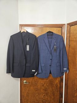 2 new michael kors suits  . Size 42L