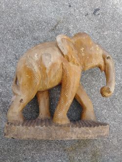 Solid wood-carved elephant statue