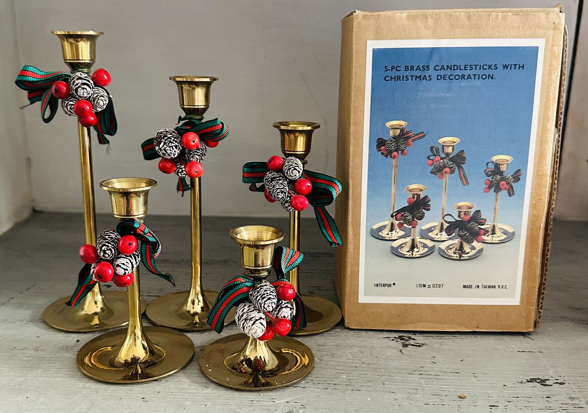 Vintage Interpur Taiwan Graduated Solid Brass Candle Holders. Unused condition wrapped in original box.  7”, 6”, 5”,4” and 3” tall . 