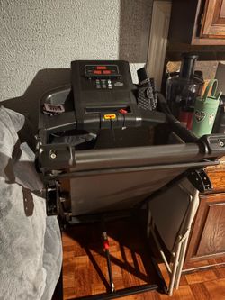 Folding electric treadmill