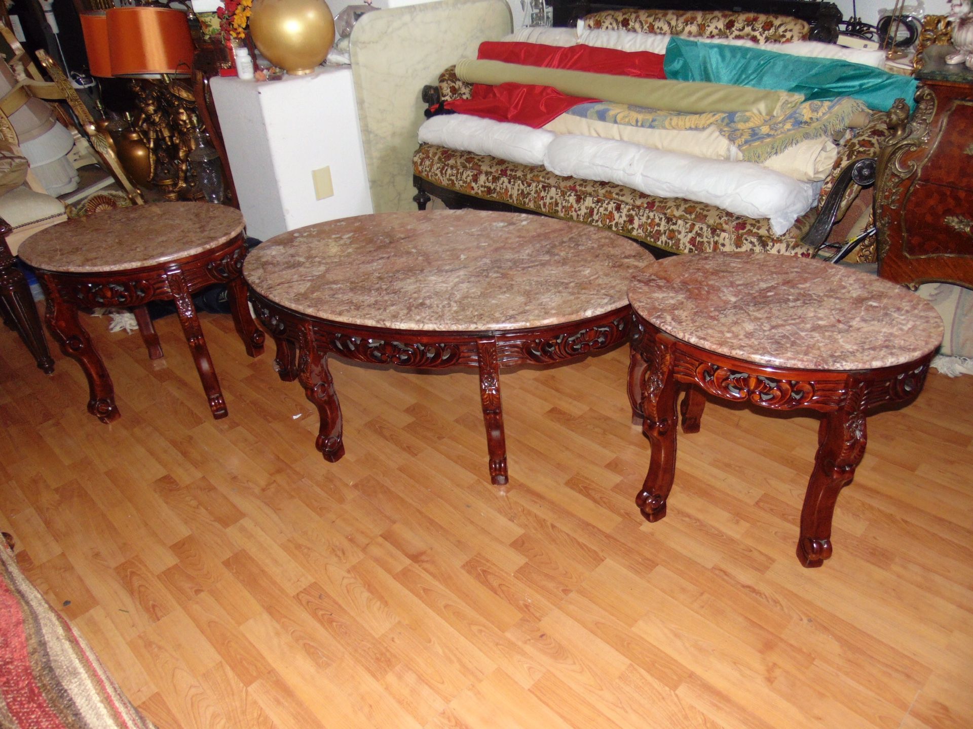 3 pink marble tables