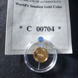 American Mint World Smallest  Gold Coin