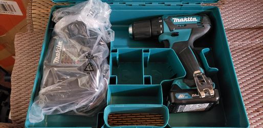 New Makita 12 volt 3/8 drill in case, charger, 3 batteries