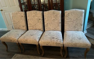Christopher Knight beige/off white linen padded parsons chairs with Parisian script. Retails $600, priced to sell           script