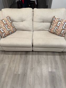 2 piece Ashely sofa and recliner with pillows