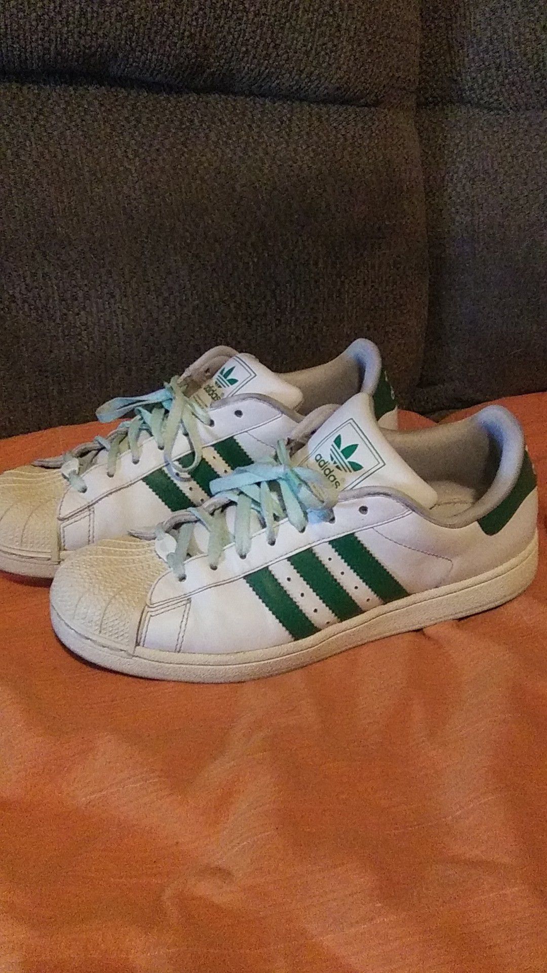 Green n white Adidas shoes