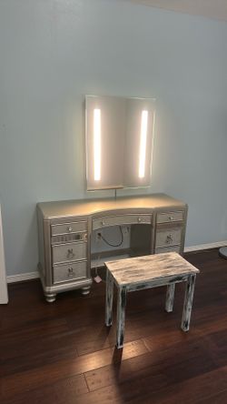Mirror with lights , vanity, and bench