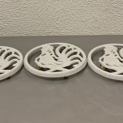 A collection of 3 vintage 1996 trivet cast iron roosters with hanging loop 7.50” long and 7” wide  If you see it here , it is available  Local pick up