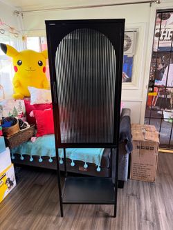 Black Metal Display Cabinet with Arched Ribbed Glass & Bottom Shelf