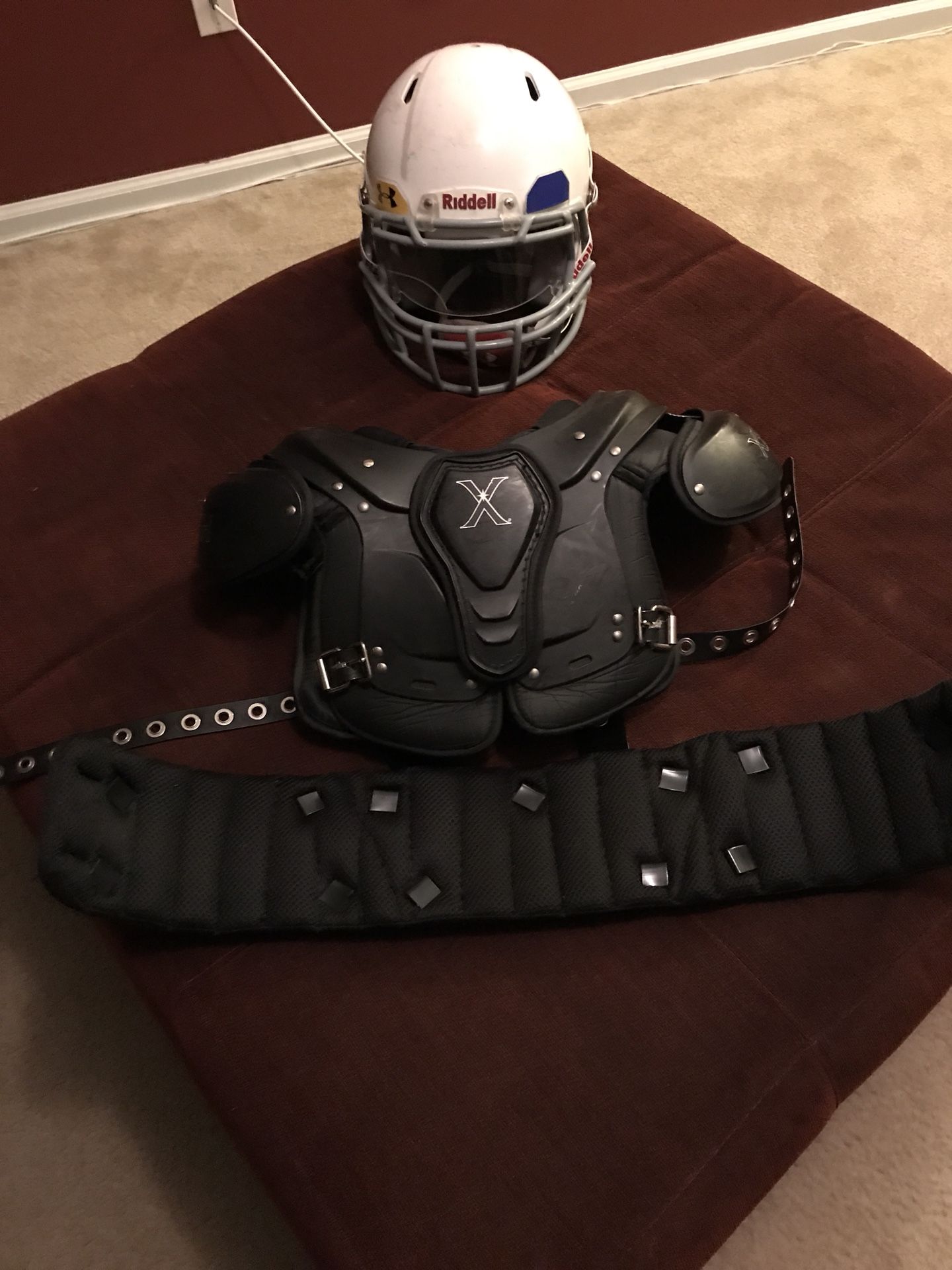 Football Shoulder Pads, Rib Protector, and Riddell Helmet With Visor