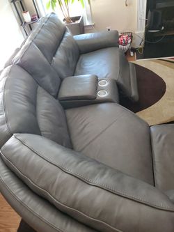 Leather sectional with 3 recliners, USB chargers.