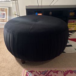 Black Ottoman With Brown Legs