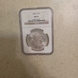 1884 O Morgan Silver Dollar.  Graded 