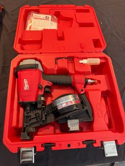 Like new Milwaukee 7120-21 pneumatic roofing nailer with unopened box of nails