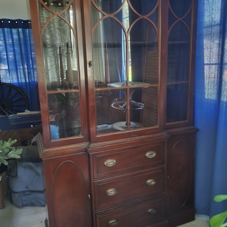 Very nice mahogany China cabinet with piano trim at the top