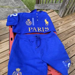 In the blue outfit is a size large $100. The white outfit with the gold writing on it is $60. The green outfit is $150. The gray shirt is $75. The mot