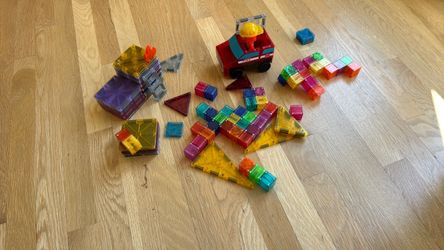 Assorted magnatiles , fire truck magnetile