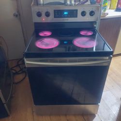 Black and Stainless Samsung 5 Burner glass top stove with Self Cleaning Oven Works Excellent