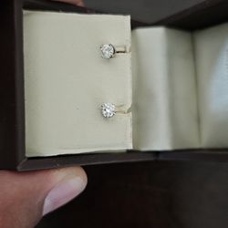 Dimond earings (pair) and wedding ring. Devons