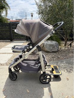 Uppababy Cruz stroller with piggyback board