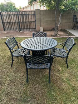 Patio set. Very nice condition. All metal. Table and chairs.