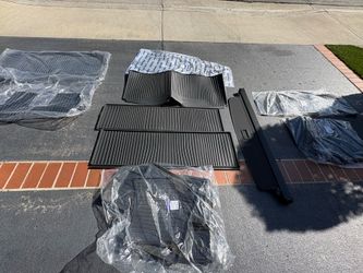 Brand new ,original set OEM “all weather floor mats”XC 90 Volvo car & retractable tonneau cover.