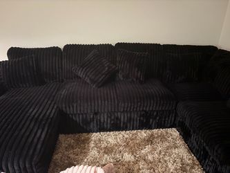 New black sectional couch with pullout bed